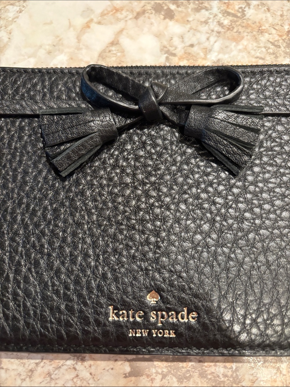 kate spade black pebbled leather wristlet with bow and tassel